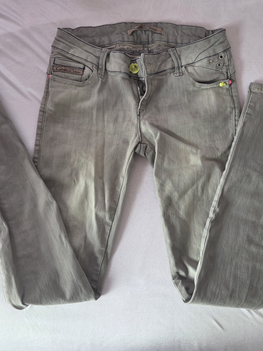 Women's Low-Rise Skinny Jeans in Washed Gray with Neon Skull details
